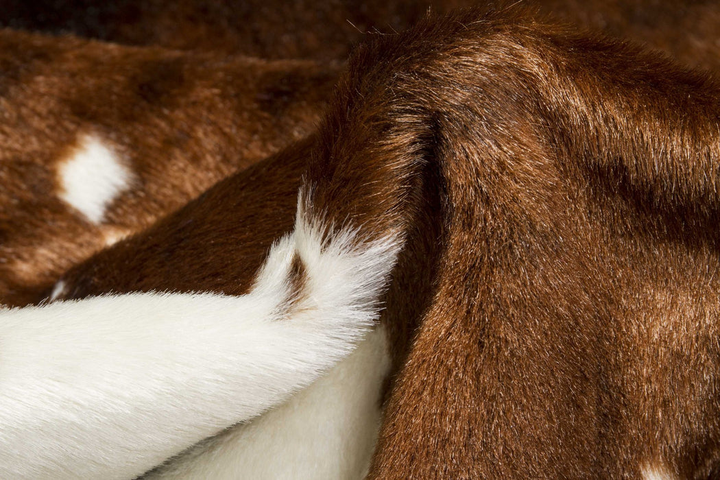 4' X 5' Faux Cow Hide Brown And White Area Rug