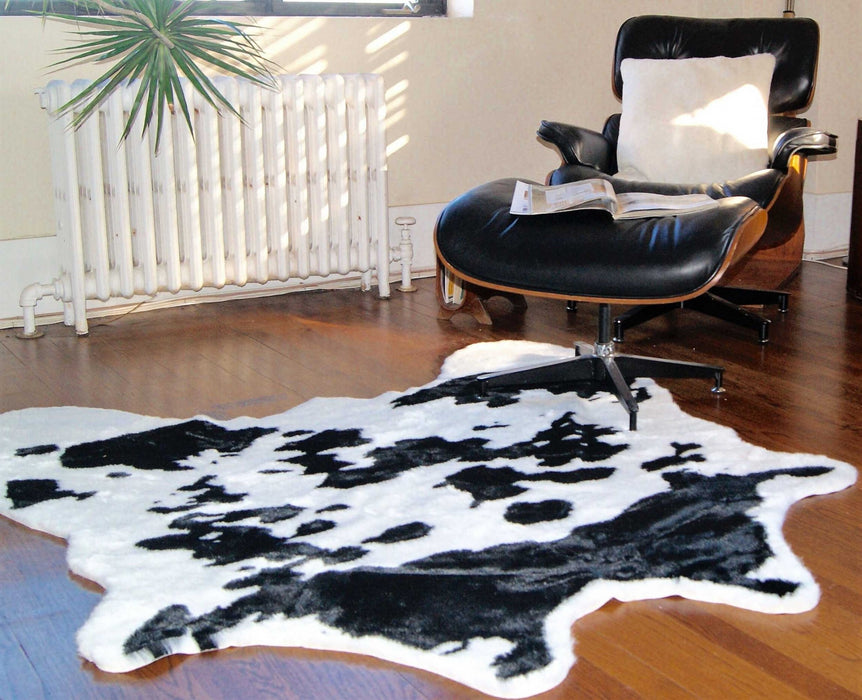 4' X 5' Faux Cow Hide Brown And White Area Rug