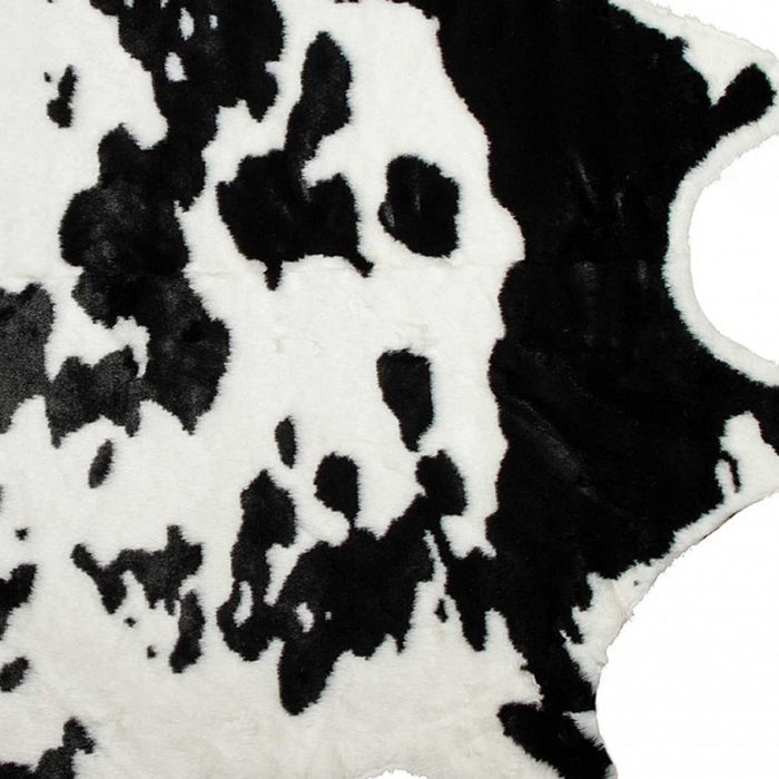 4' X 5' Faux Cow Hide Brown And White Area Rug