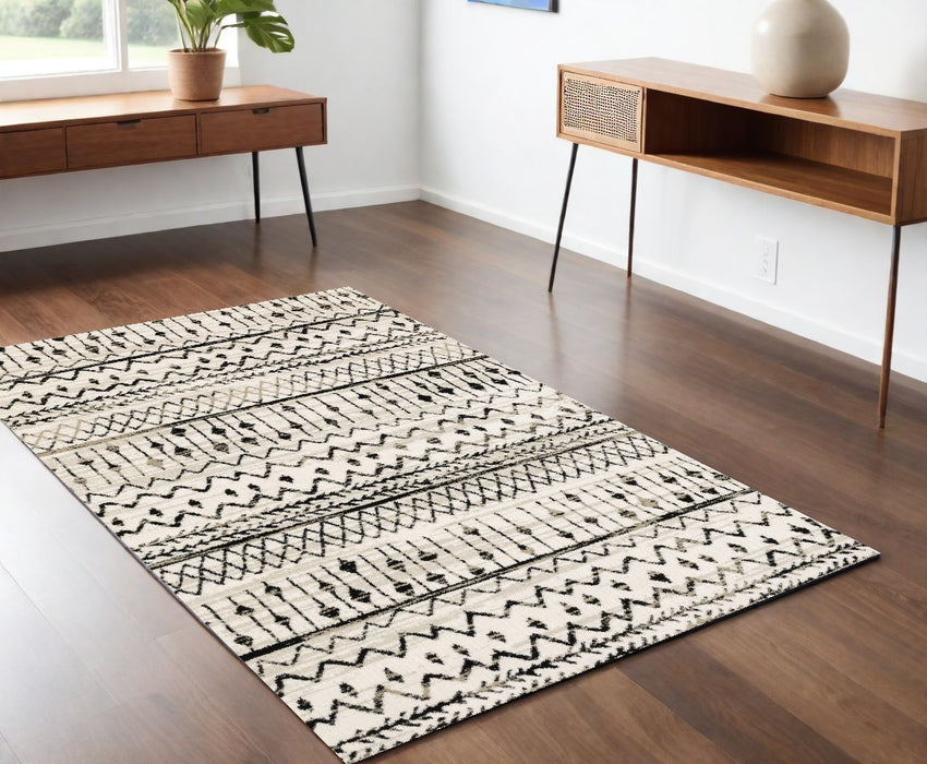 4' X 6' Ivory And Black Eclectic Patterns Indoor Area Rug