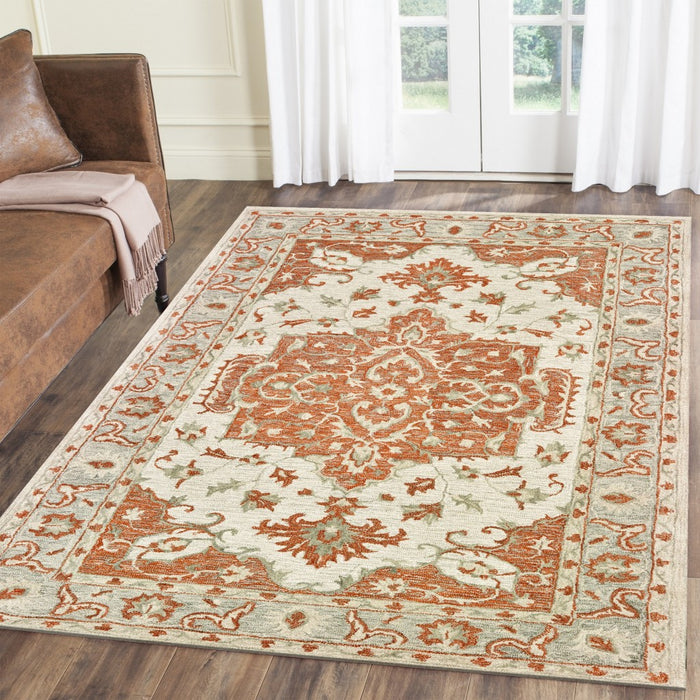 5' X 8' Orange and Ivory Medallion Area Rug