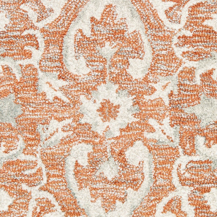 5' X 8' Orange and Ivory Medallion Area Rug