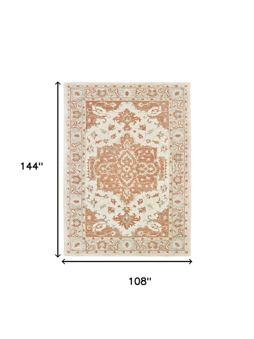 5' X 8' Orange and Ivory Medallion Area Rug