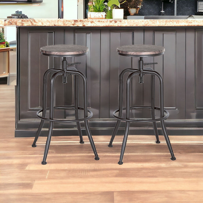 Set of Two Brown And Black Solid Wood And Steel Swivel Backless Counter Height Bar Chairs