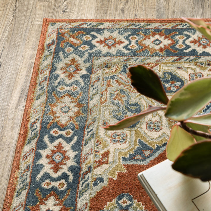 5' X 7' Rust Beige Teal Blue And Gold Oriental Power Loom Stain Resistant Area Rug