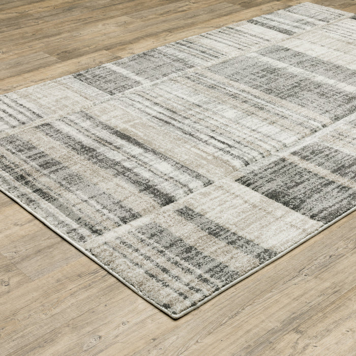 5' X 8' Grey Charcoal Ivory Tan Brown And Beige Geometric Power Loom Stain Resistant Area Rug