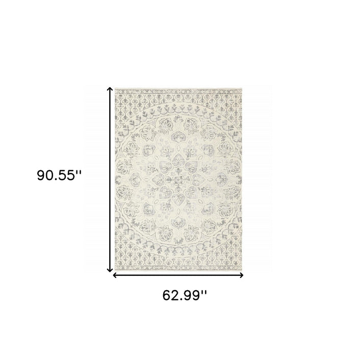 5' X 8' Ivory And Grey Floral Power Loom Stain Resistant Area Rug