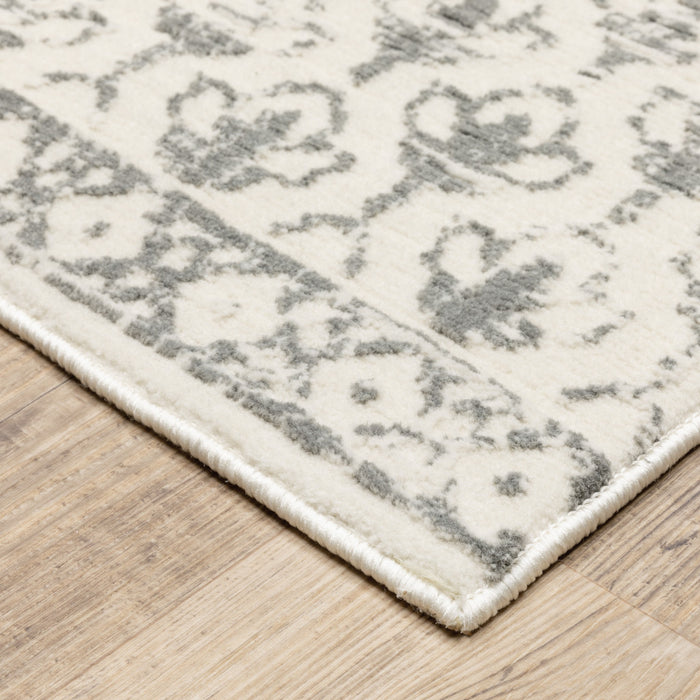 5' X 8' Ivory And Grey Floral Power Loom Stain Resistant Area Rug