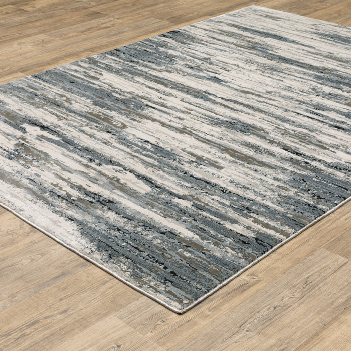 10' X 13' Blue Grey Beige And Brown Abstract Power Loom Stain Resistant Area Rug