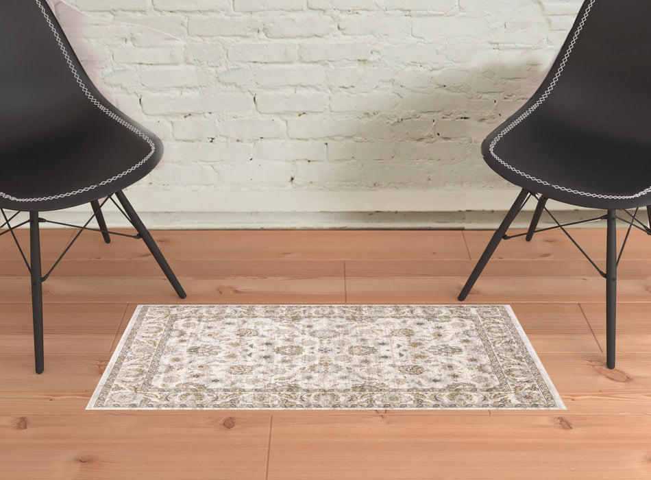 2' X 3' Ivory And Grey Oriental Power Loom Stain Resistant Area Rug With Fringe