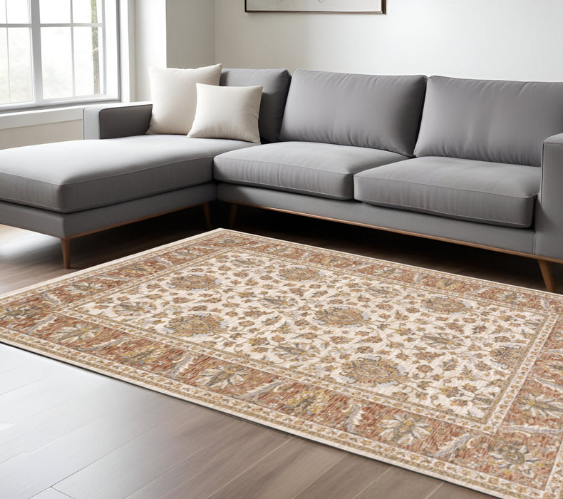 6' X 9' Rust And Ivory Oriental Power Loom Stain Resistant Area Rug With Fringe