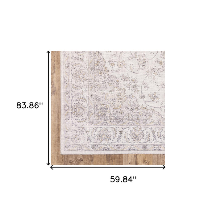 5' X 7' Beige Gold And Grey Oriental Power Loom Stain Resistant Area Rug