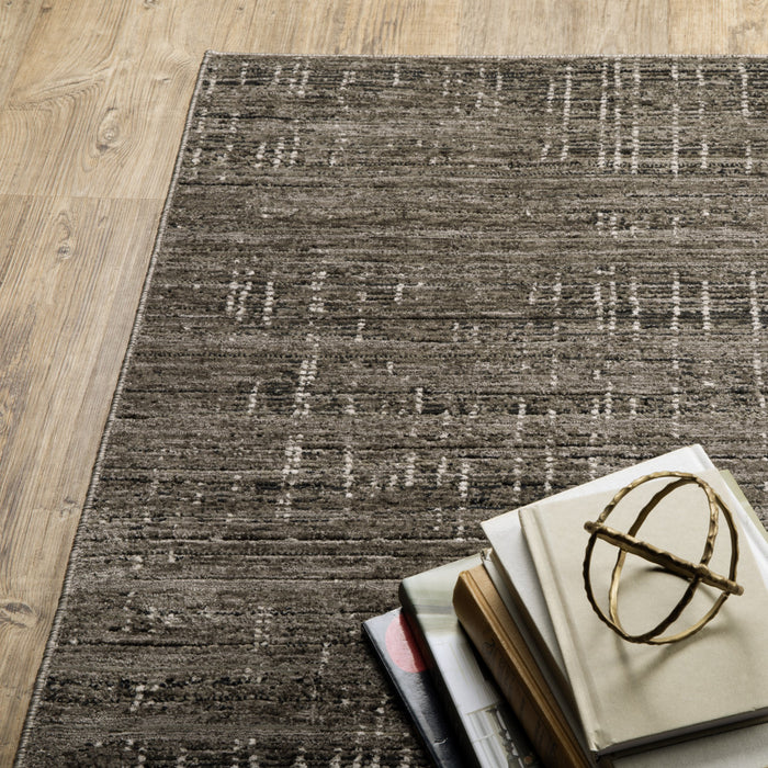 5' X 8' Charcoal Grey Grey Ivory Tan And Brown Abstract Power Loom Stain Resistant Area Rug