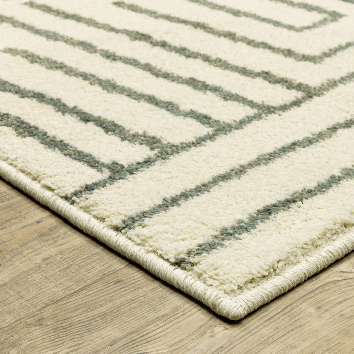 5' X 7' Beige Grey And Light Blue Geometric Power Loom Stain Resistant Area Rug