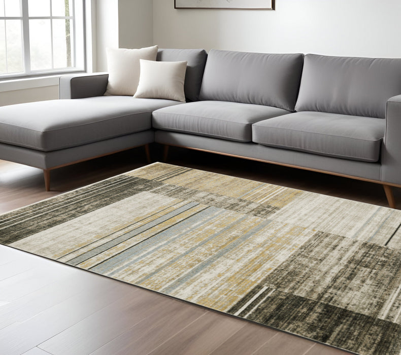 10' X 13' Beige Charcoal Brown Grey Tan Gold And Blue Geometric Power Loom Stain Resistant Area Rug With Fringe