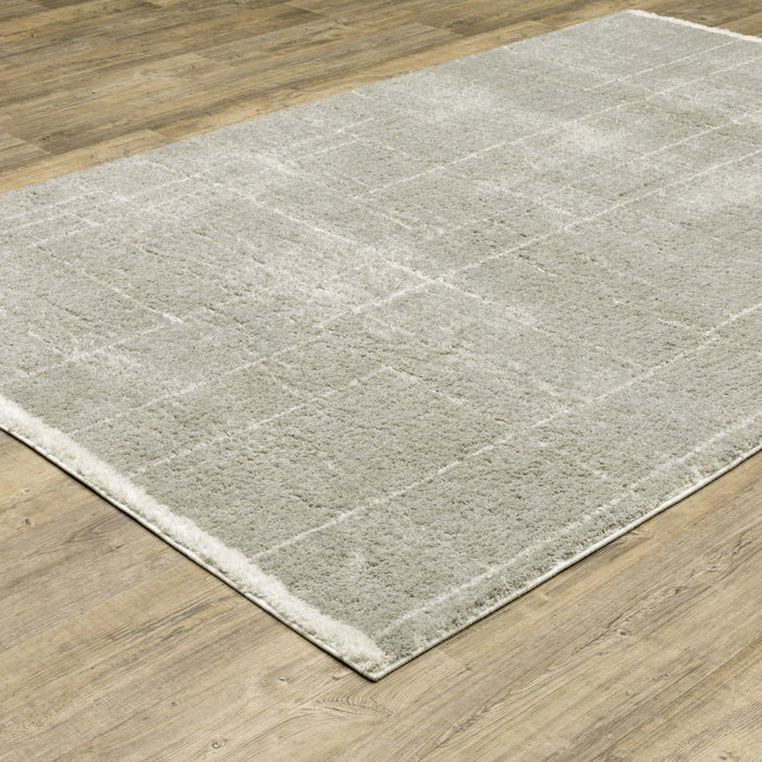 10' X 13' Grey And Ivory Geometric Shag Power Loom Stain Resistant Area Rug