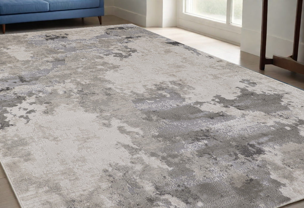 5' X 8' Ivory And Gray Abstract Stain Resistant Area Rug