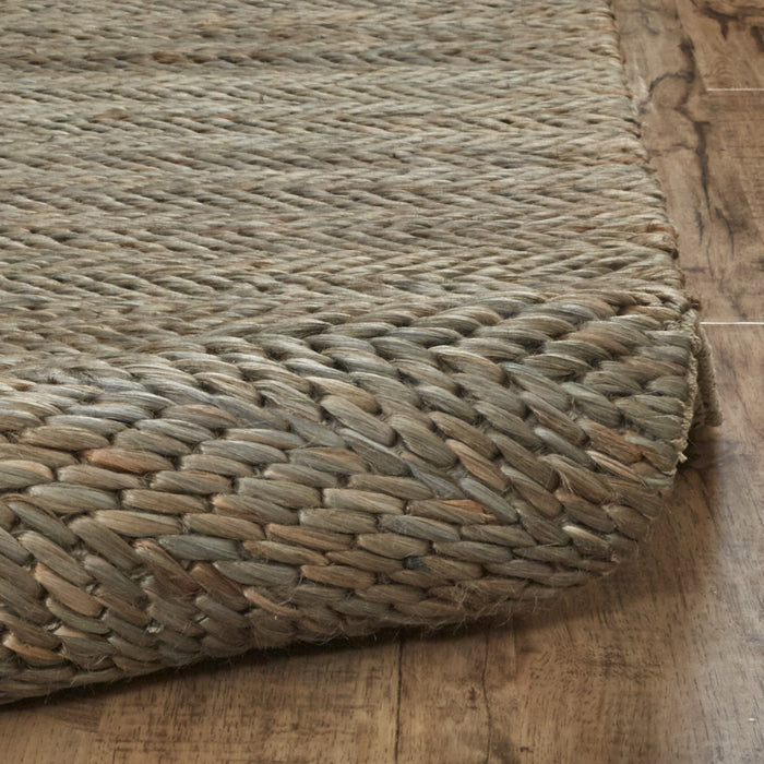 5' X 8' Tan And Gray Hand Woven Area Rug