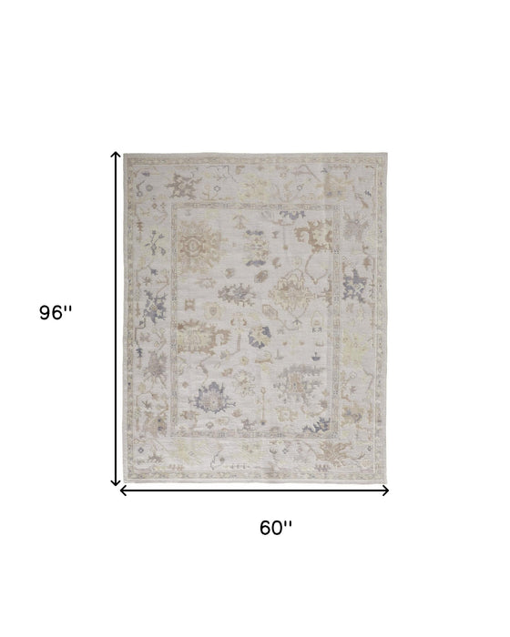 4' X 6' Tan Ivory And Orange Floral Hand Knotted Stain Resistant Area Rug