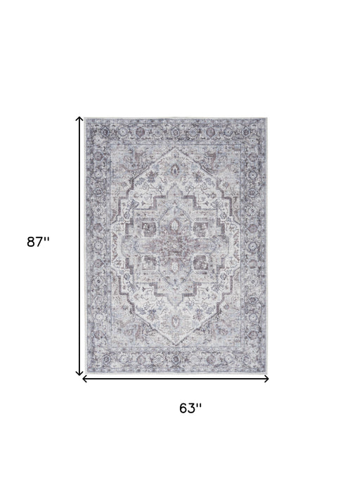 5' X 7' Blue And Pink Floral Power Loom Distressed Washable Area Rug