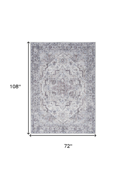 6' X 9' Blue And Pink Floral Power Loom Distressed Washable Area Rug