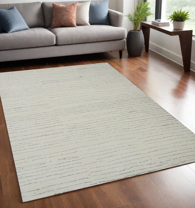 5' X 8' Beige and Gray Abstract Power Loom Distressed Non Skid Area Rug