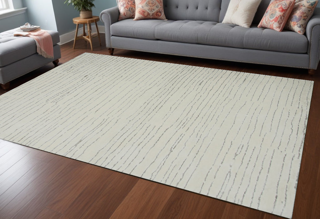 7' X 10' Beige and Gray Abstract Power Loom Distressed Non Skid Area Rug