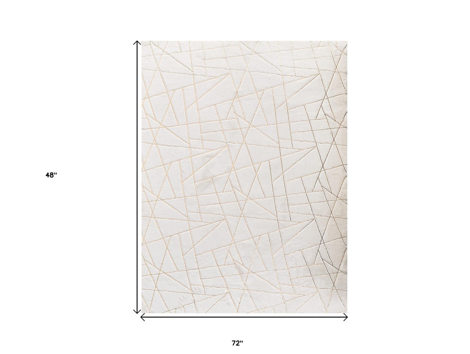 4' X 6' White and Gold Faux Fur Abstract Shag Non Skid Area Rug