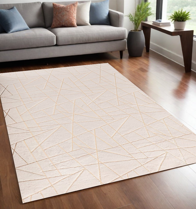 2' X 3' Beige and Gold Faux Fur Abstract Shag Non Skid Area Rug