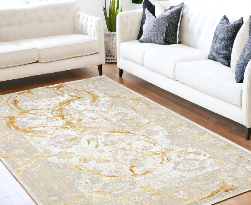 5' X 8' Beige and Gold Abstract Area Rug