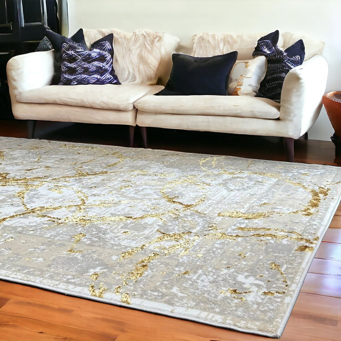 5' X 8' Beige and Gold Abstract Area Rug