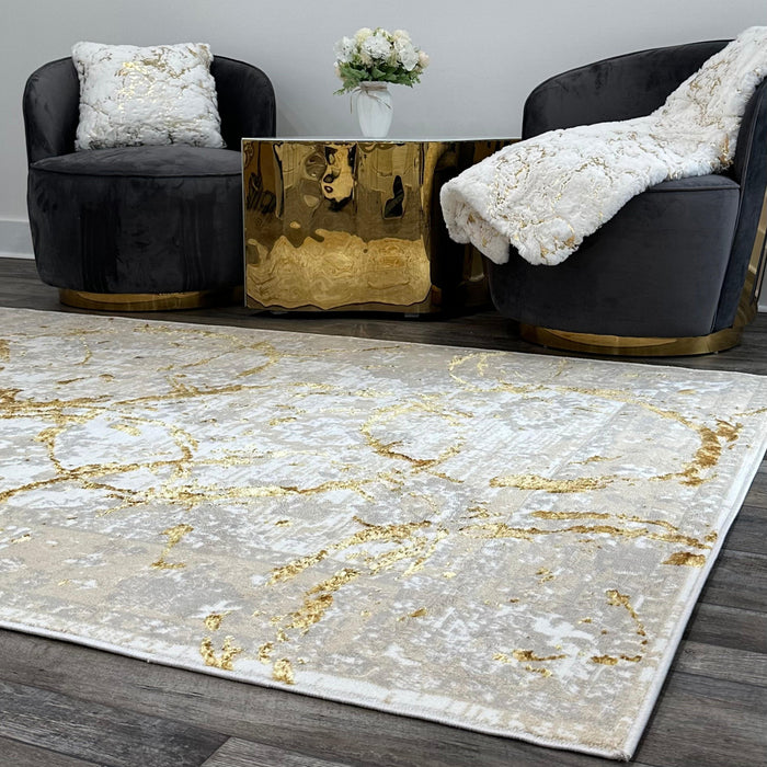 5' X 8' Beige and Gold Abstract Area Rug