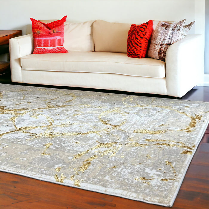 5' X 8' Beige and Gold Abstract Area Rug