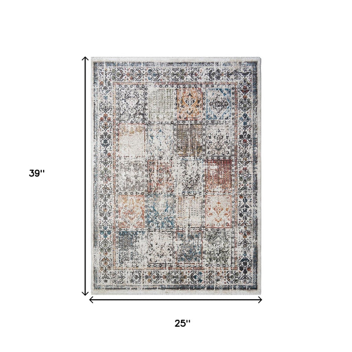 2' X 3' Ivory Blue and Gray Patchwork Distressed Area Rug With Fringe