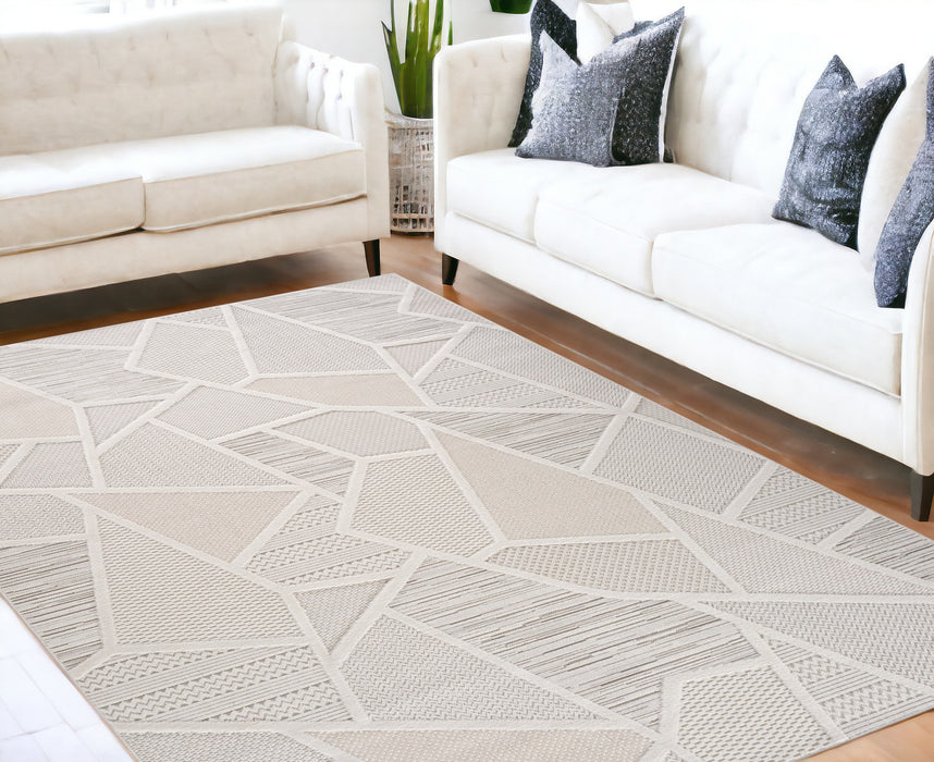 5' X 8' Cream and Beige Geometric Distressed Area Rug