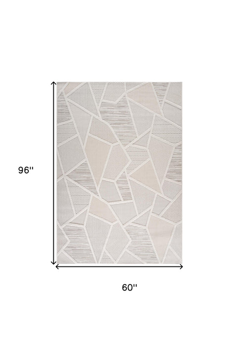 5' X 8' Cream and Beige Geometric Distressed Area Rug