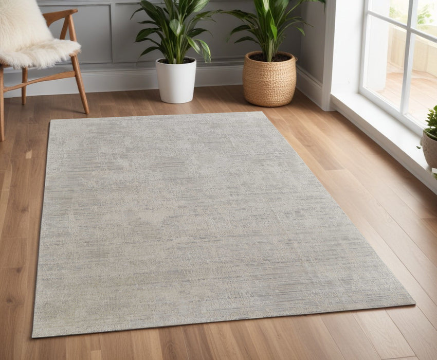 4' X 6' Gray and Ivory Abstract Hand Woven Worn Faded Area Rug