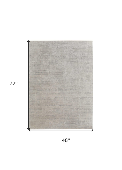 4' X 6' Gray and Ivory Abstract Hand Woven Worn Faded Area Rug