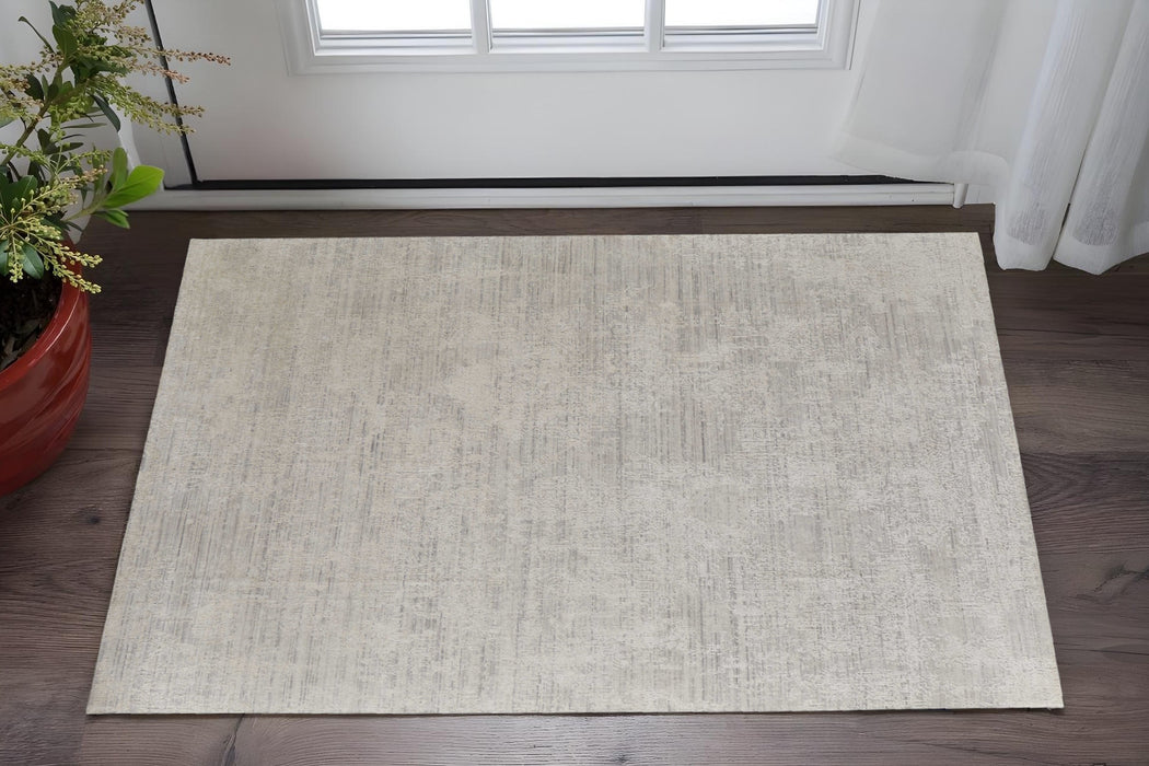 4' X 6' Gray and Ivory Abstract Hand Woven Worn Faded Area Rug