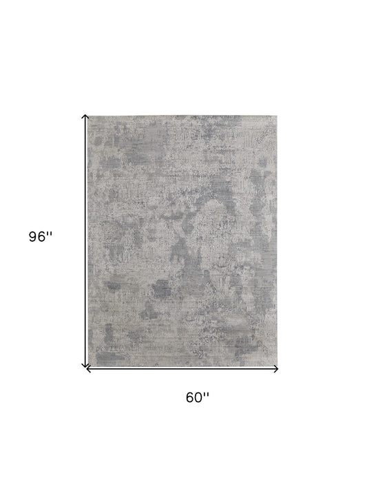 4' X 6' Gray and Ivory Abstract Hand Woven Worn Faded Area Rug