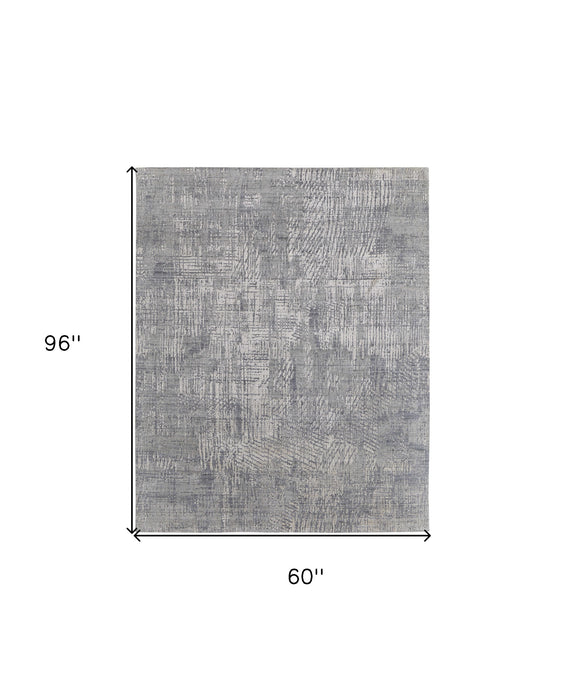 5' X 8' Gray and Silver Abstract Hand Woven Worn Faded Area Rug