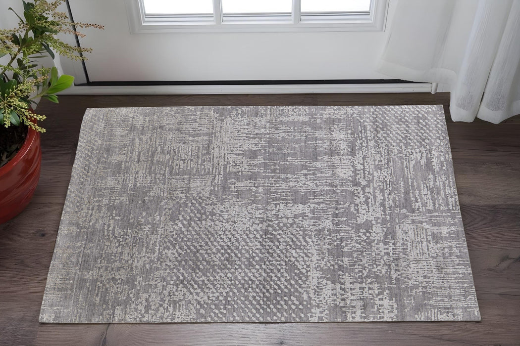 5' X 8' Gray and Silver Abstract Hand Woven Worn Faded Area Rug