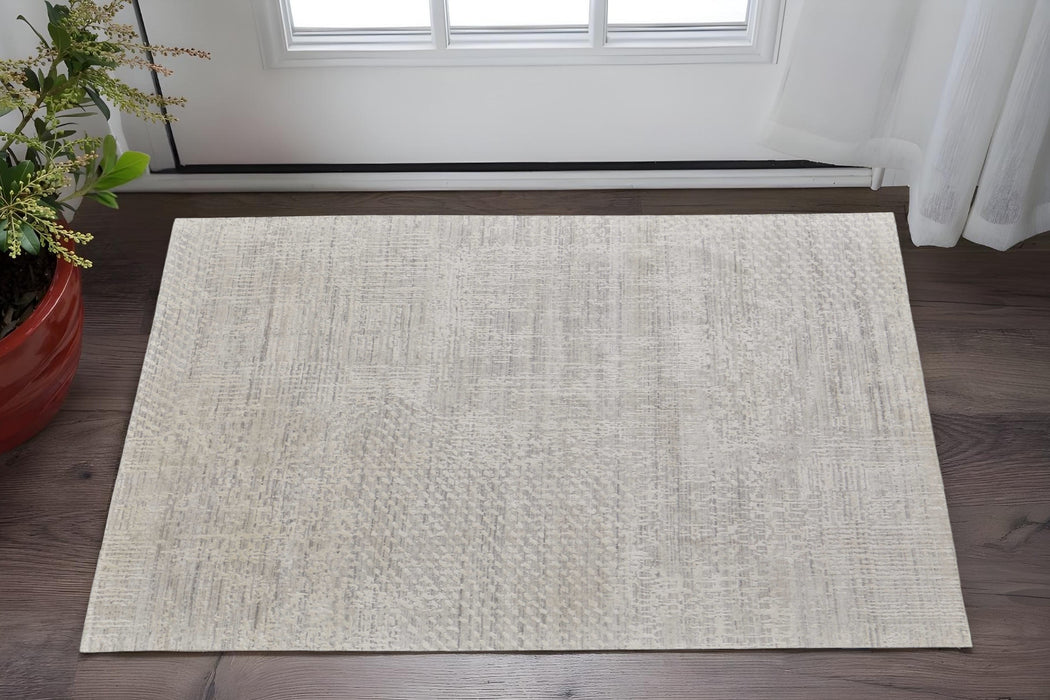 5' X 8' Ivory and Gray Abstract Hand Woven Worn Faded Area Rug