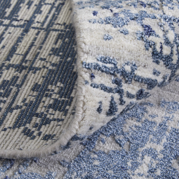 5' X 8' Blue and Ivory Abstract Hand Woven Worn Faded Area Rug