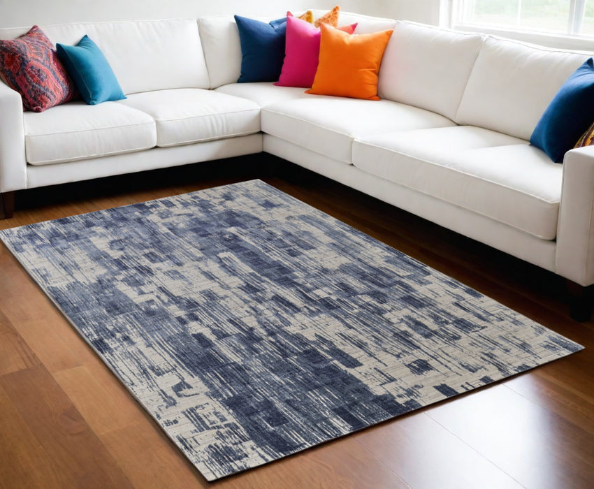 5' X 8' Blue and Ivory Abstract Hand Woven Worn Faded Area Rug