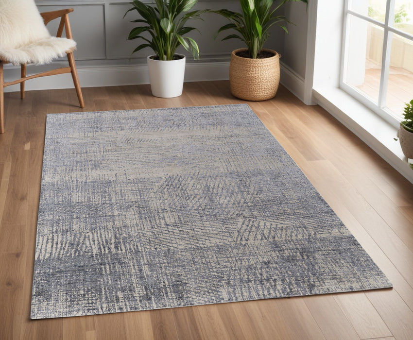 4' X 6' Gray Ivory and Blue Abstract Hand Woven Worn Faded Area Rug